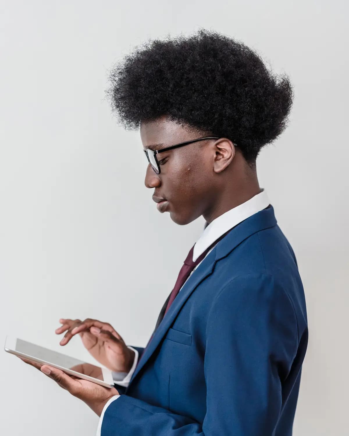 A young professional reading from a tablet